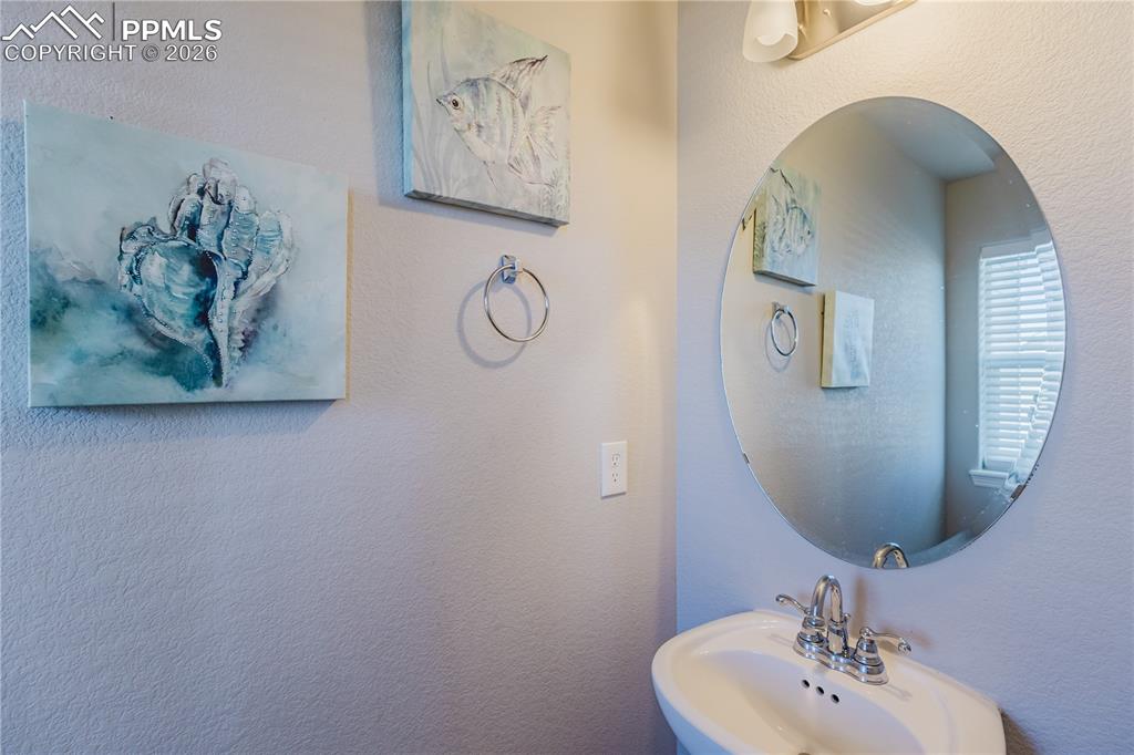 Image 22 of 39: main level half bathroom