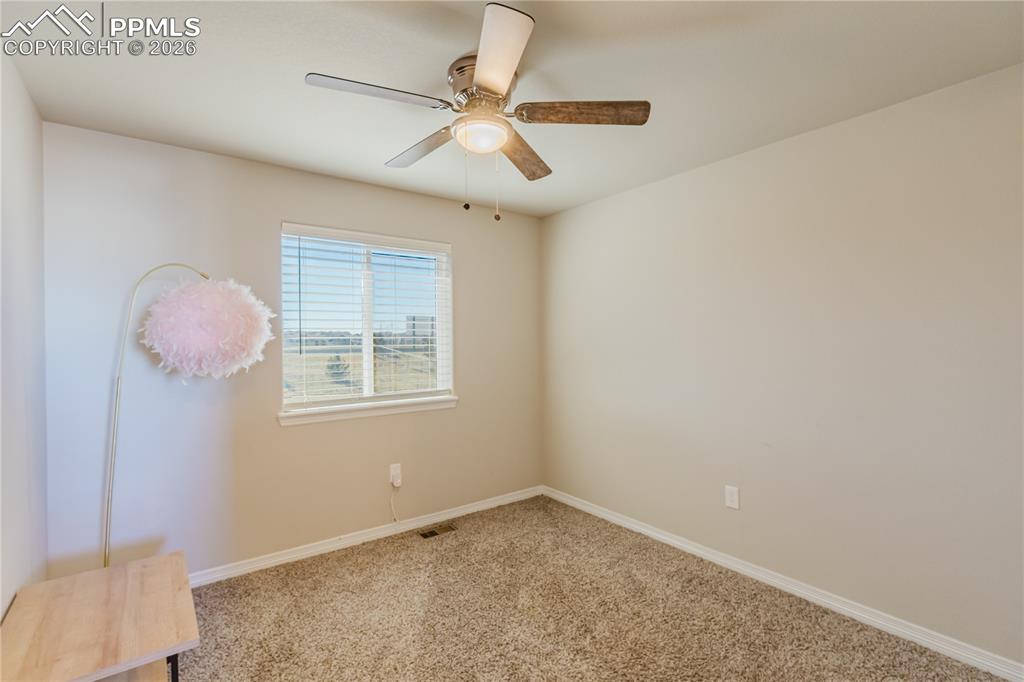 Image 23 of 39: 1st bedroom from entry way