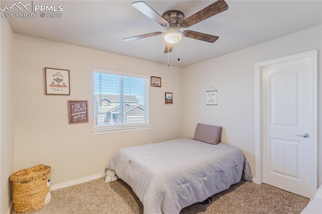 Image 35 of 39: 2nd bedroom through entryway