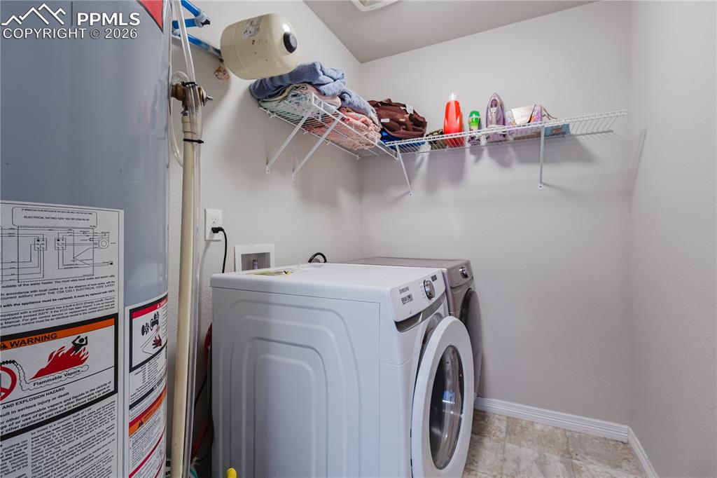 Image 37 of 39: upstairs laundry room on the same level as bedrooms