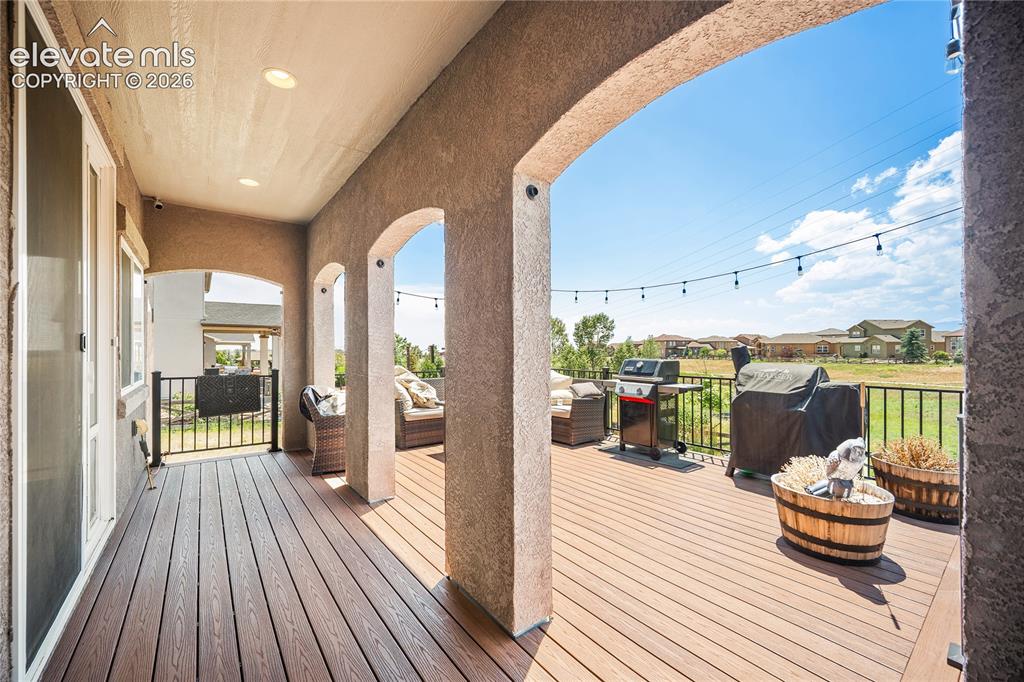 Image 16 of 49: Partially covered deck