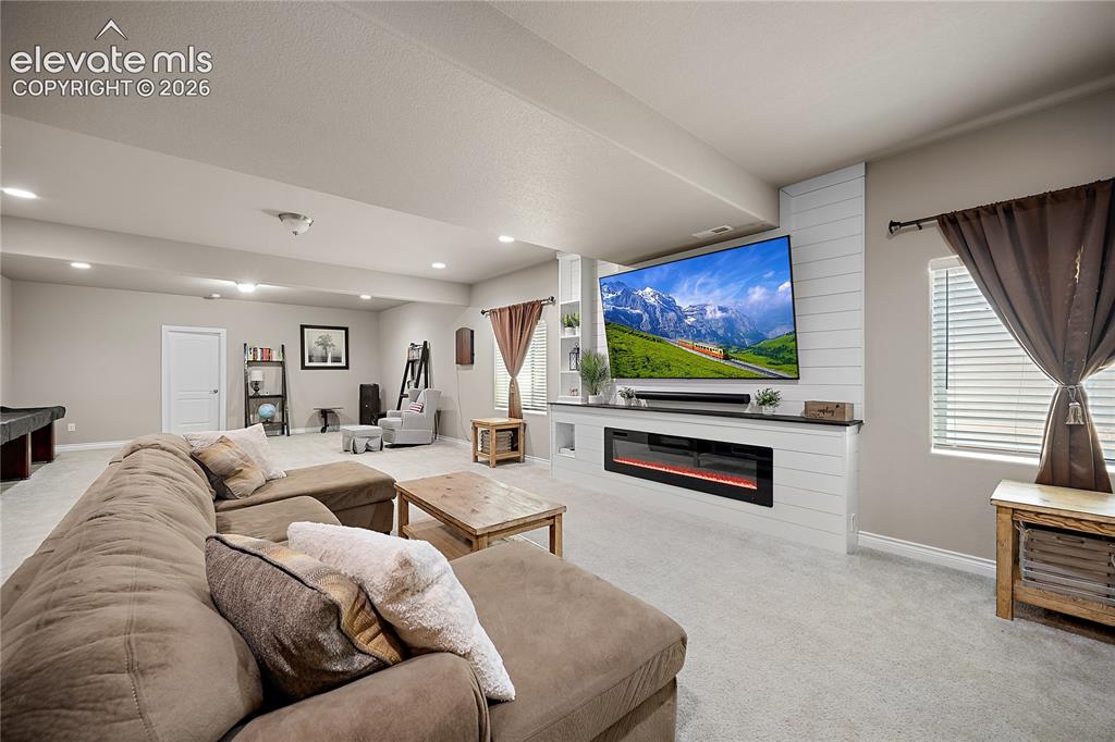 Image 25 of 49: Basement family room with endless possibilities.