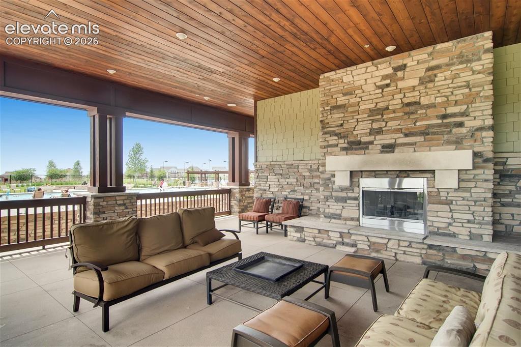 Image 46 of 49: Large covered patio overlooking the pool area.