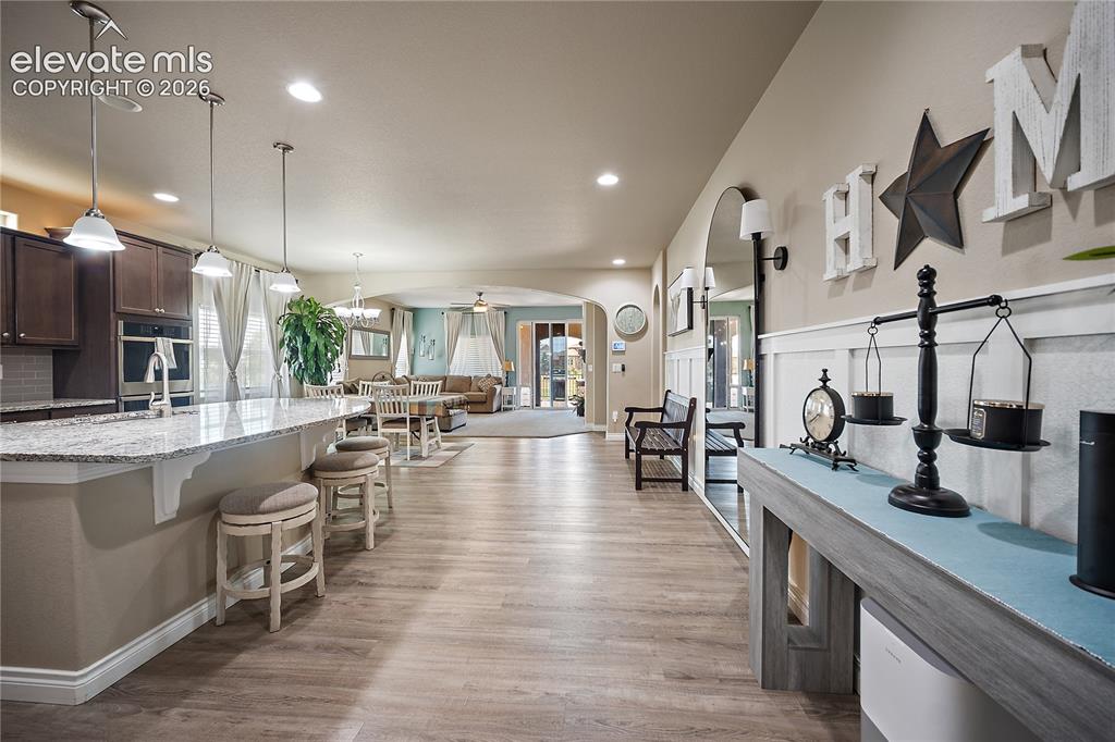 Image 7 of 49: Open concept, kitchen, dining, and living room.