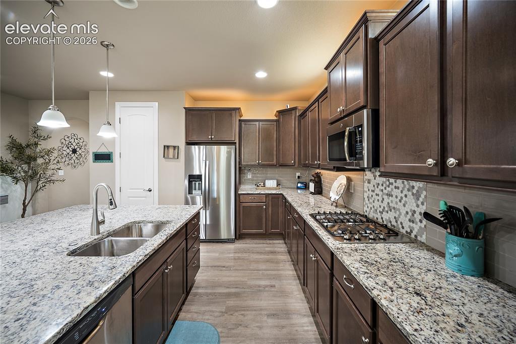 Image 9 of 49: Gas range, kitchen pantry and tons of counter and cabinet space.