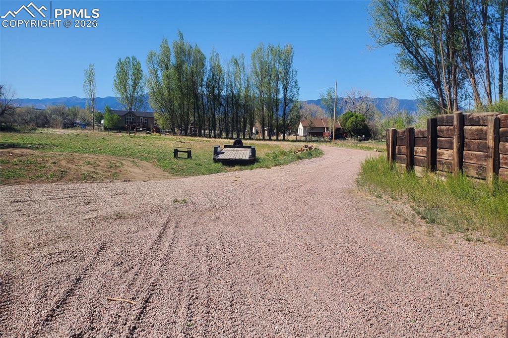 Image 12 of 27: This view south shows the front half of the lot facing the street and views