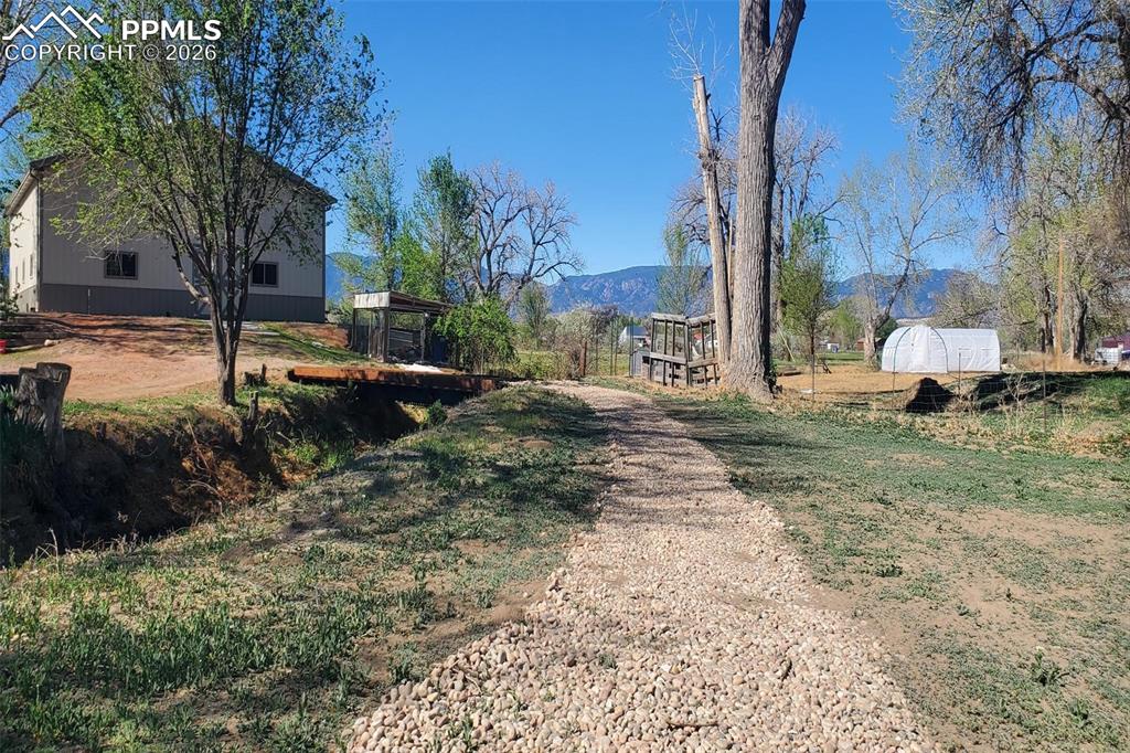 Image 14 of 27: This is the view from the launch input back to the barn.