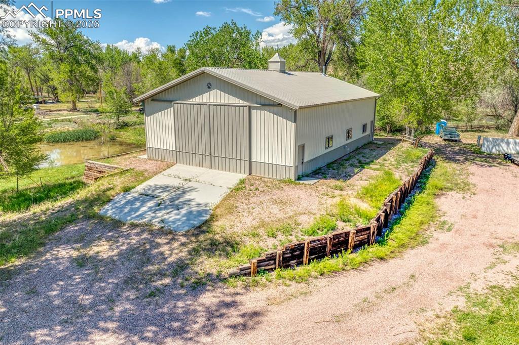 Image 2 of 27: The 40x60 ft outbuilding is insulated, with 2 electrical panels, a propane