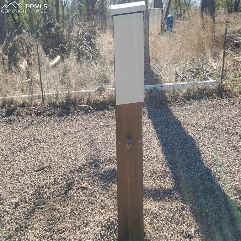Image 6 of 27: This RV hook-up is located on the east side of the lot.
