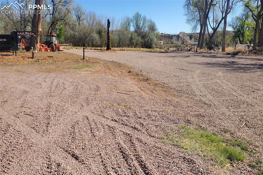 Image 7 of 27: The back half of the lot has been extensively leveled and cleared to enjoy