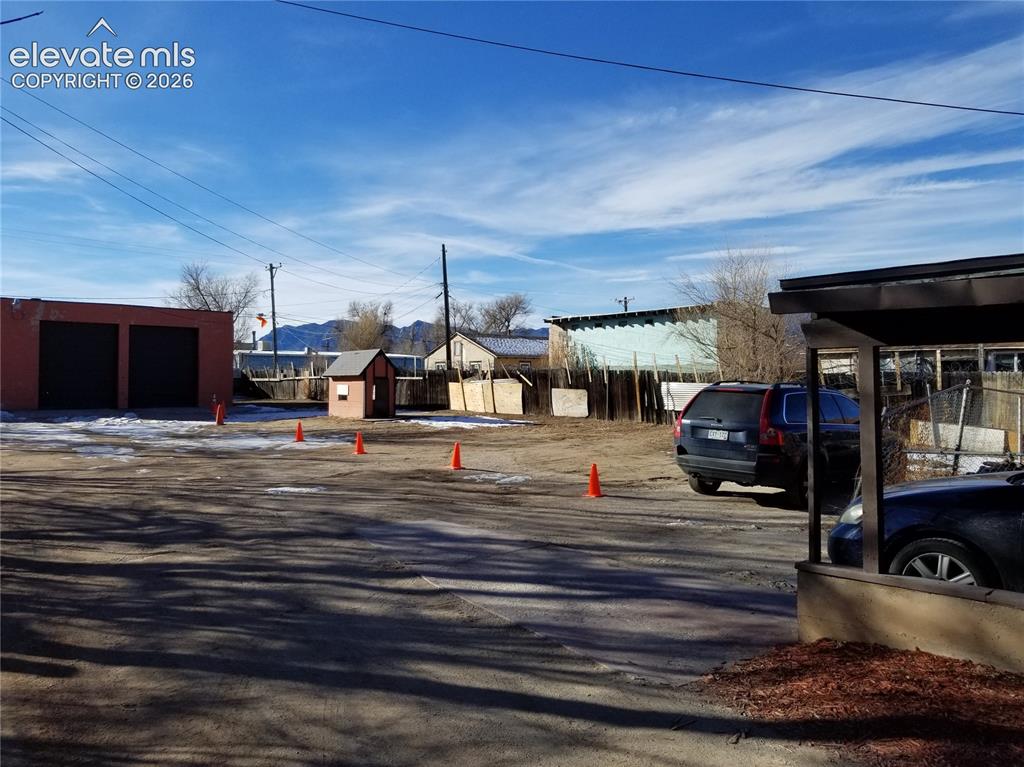 Image 4 of 12: South facing exterior with rented parking