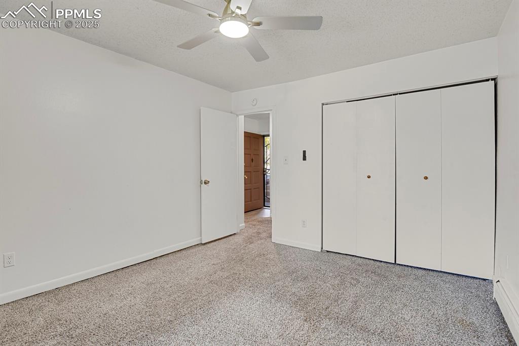 Image 10 of 17: Second bedroom.