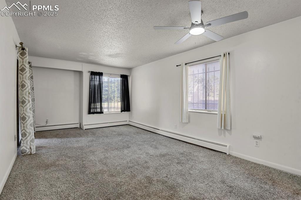 Image 2 of 17: Spacious Living/Dining Room. Walkout to Patio.