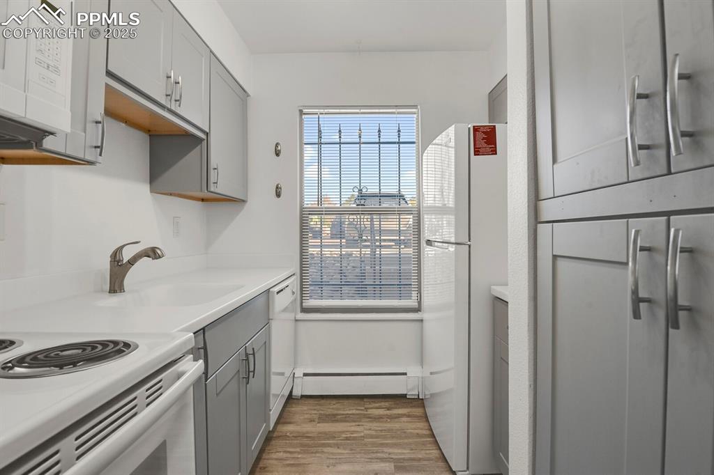 Image 5 of 17: Kitchen featuring upgraded cabinetry and appliances