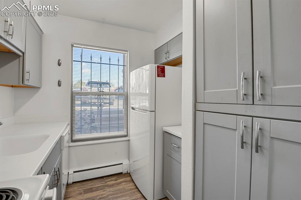 Image 7 of 17: Kitchen featuring upgraded cabinetry and appliances