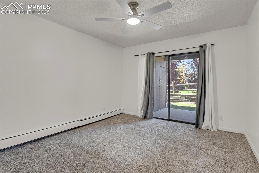 Image 9 of 17: Main Bedroom with walk-out to patio
