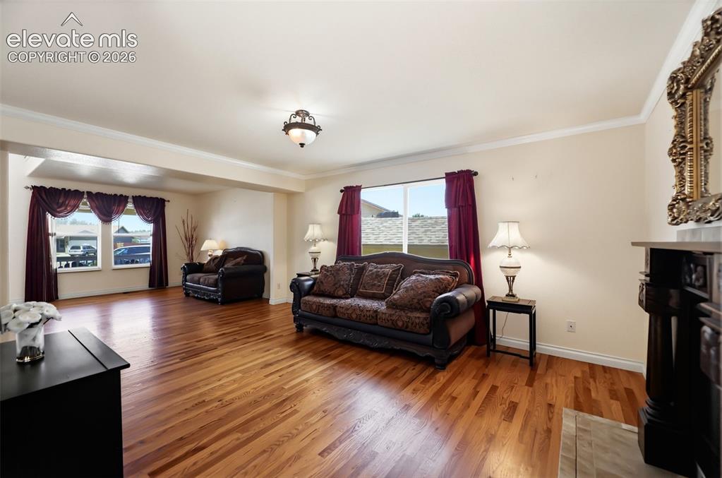 Image 12 of 50: Hardwood flooring throughout the main living area