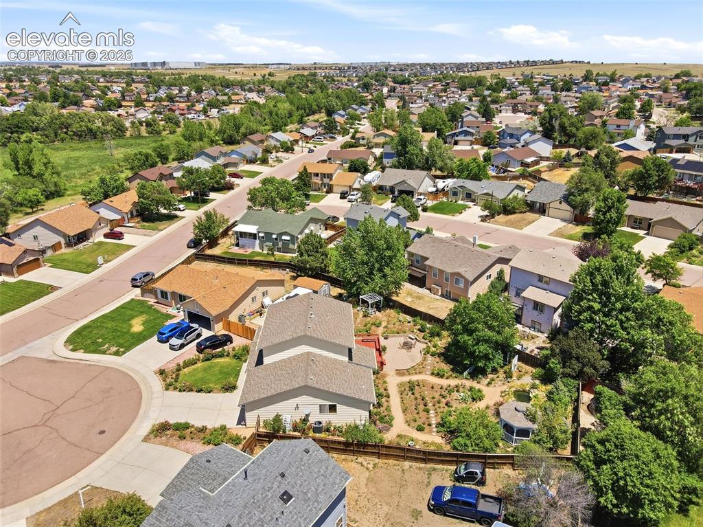 Image 45 of 50: Aerial perspective showcasing a residential neighborhood with varied archit