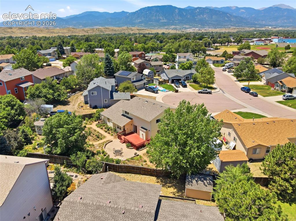 Image 46 of 50: Aerial perspective showcasing a residential neighborhood with surrounding n