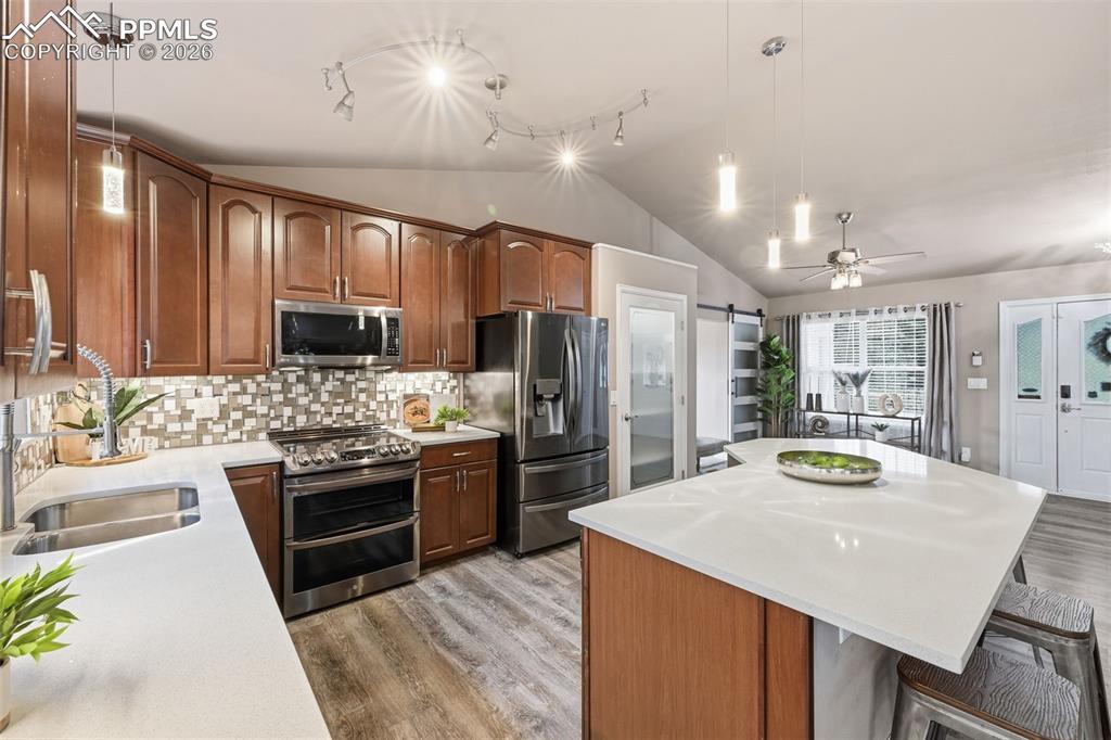 Image 13 of 50: Another view of the kitchen. A beautiful place to entertain!