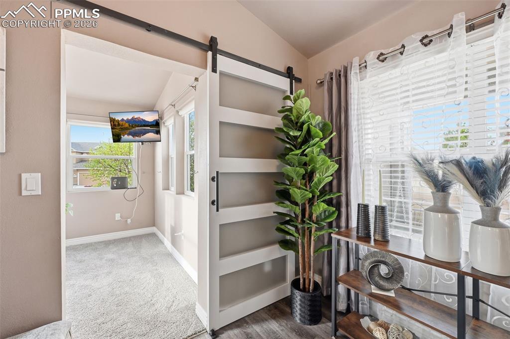 Image 18 of 50: The entrance to the sun room with a southern exposure. Warm and inviting ev