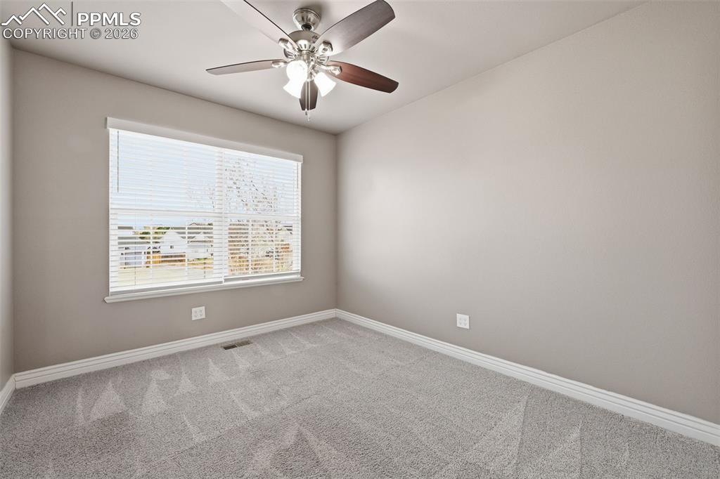 Image 28 of 50: One of the secondary bedrooms upstairs.