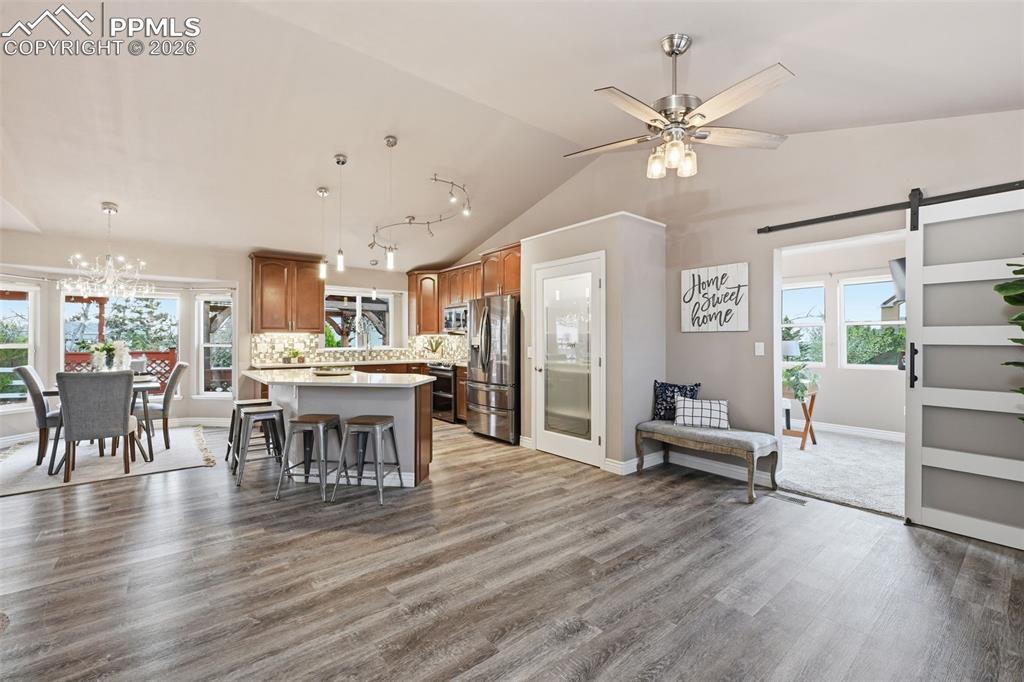 Image 3 of 50: So much space for entertaining. Vaulted ceilings makes it feel even more sp