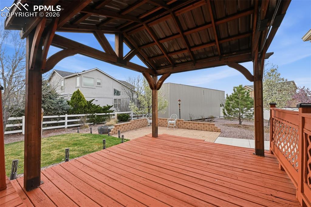 Image 38 of 50: The area with the gazebo provides even more area to enjoy rain or shine.