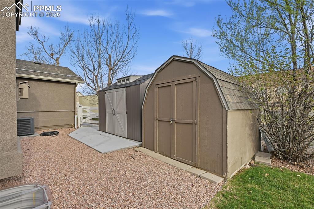 Image 42 of 50: Plenty of space to store all of your things. The left shed is on a concrete