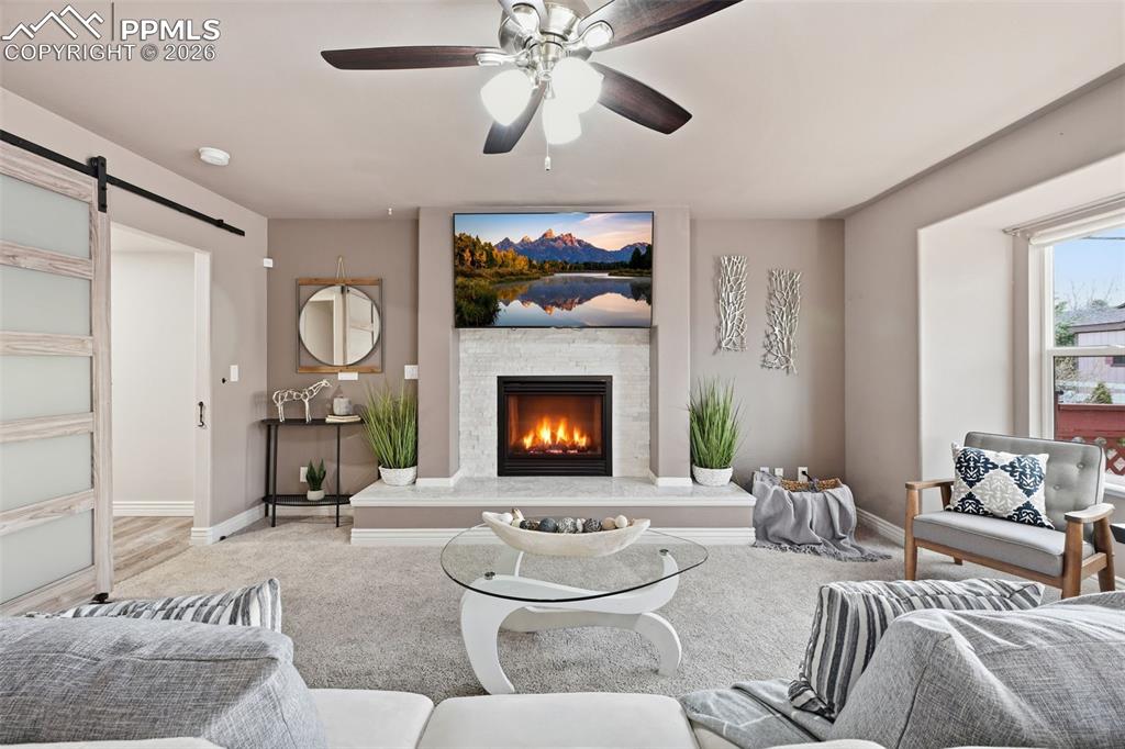 Image 6 of 50: Imagine enjoying the fireplace on cold winter nights. The entrance to the m