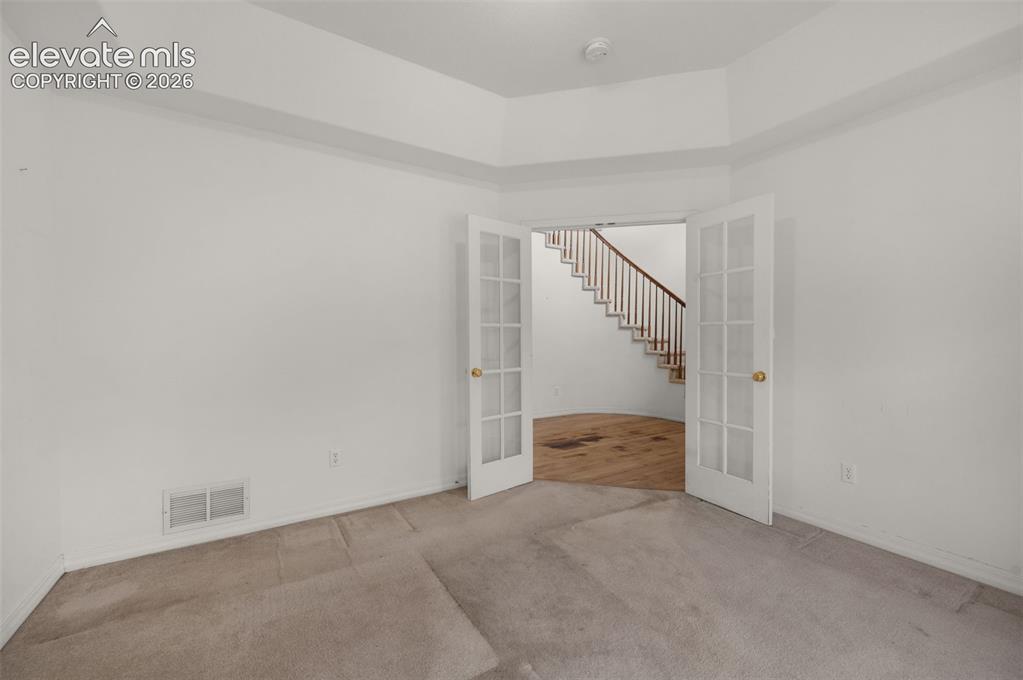 Image 19 of 48: Main Level Office Featuring French Doors