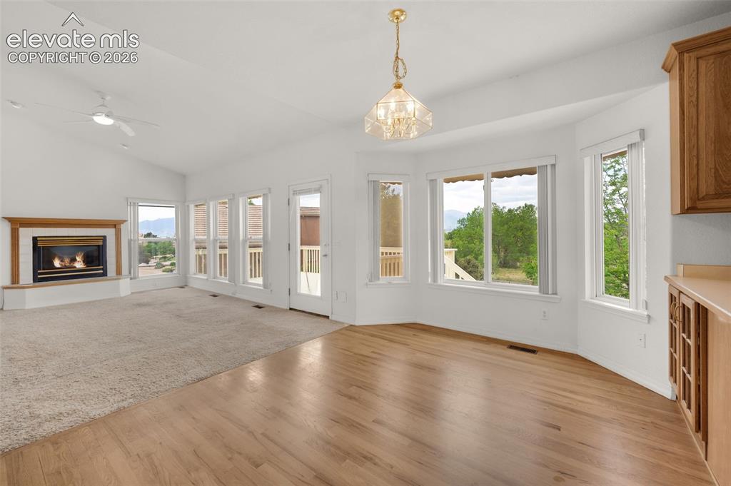 Image 20 of 48: Breakfast Nook Adjoining Family Room Featuring Bay Window and Hardwood Floo