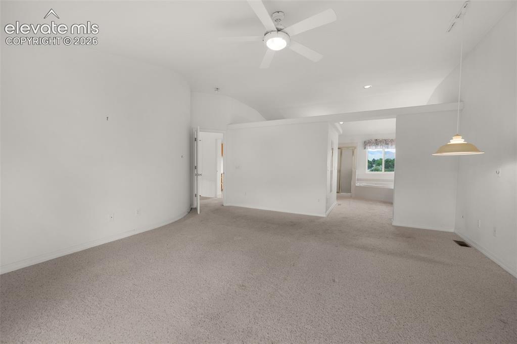 Image 24 of 48: Primary Bedroom and Adjoining 5 Piece Bath with Jetted Tub and Large Walk-i