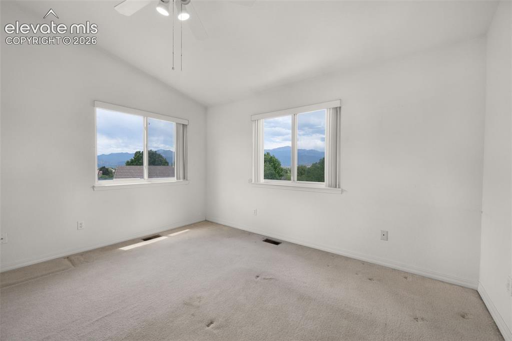 Image 29 of 48: Second Upstairs Bedroom with Vaulted Ceilings and Walk-in Closet