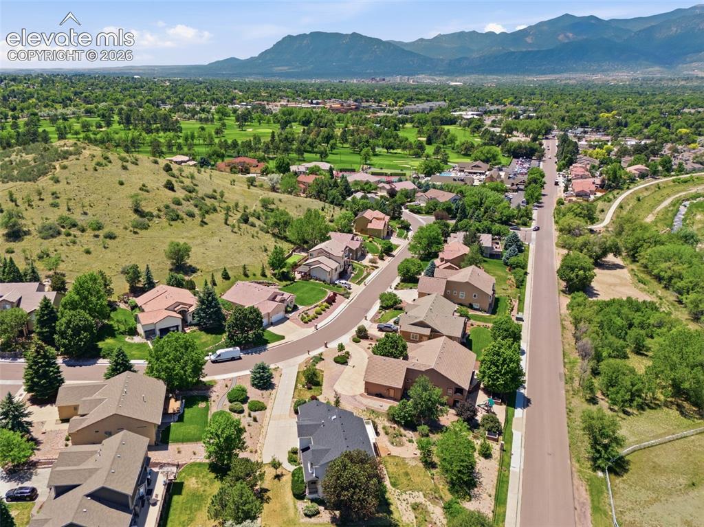 Image 44 of 48: Aerial View of the Home and the Nearby Colorado Springs Country Club Golf C