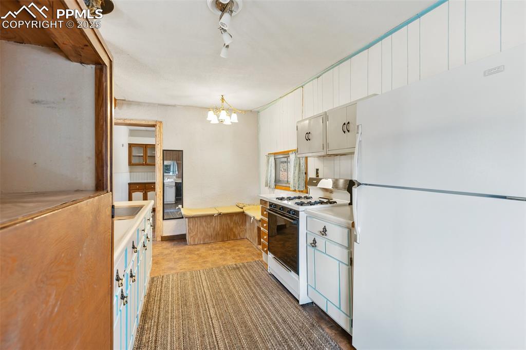 Image 12 of 41: Large kitchen with lots of cabinet space. Cute rustic feel with room to mod