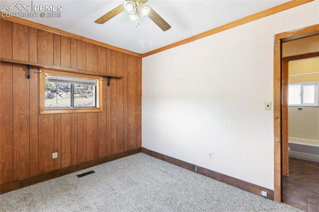 Image 17 of 41: Tiled hallway and easy flow floor plan. Living spaces away from the bedroom
