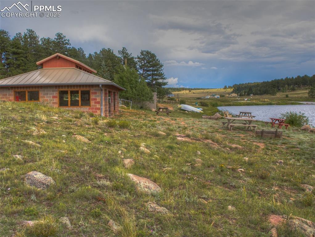 Image 38 of 41: Wagon Tongue Community in Florissant Colorado. Picnic, boat, fish, canoe. 