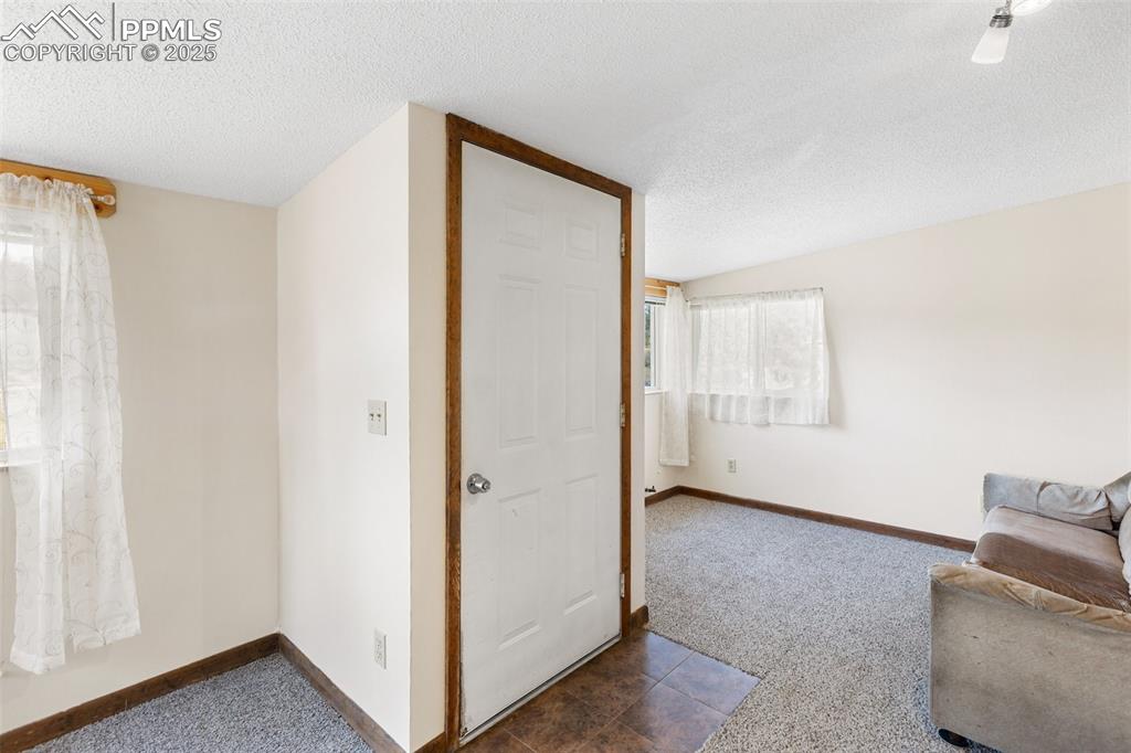 Image 5 of 41: Finished and enclosed living room adds additional living space. 