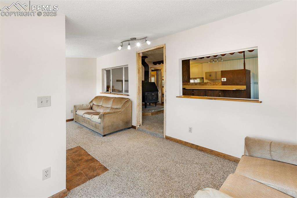 Image 7 of 41: Plenty of sun and passive solar gain. Living room flows into the family roo