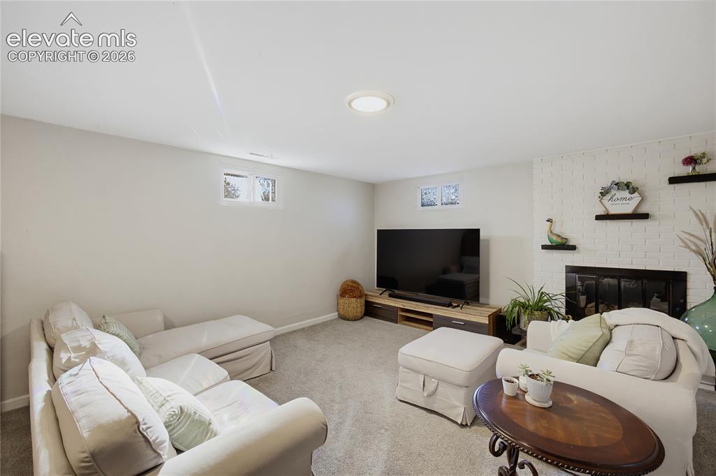 Image 21 of 29: Recessed ceiling lighting, carpeted flooring, two permanent windows, painte
