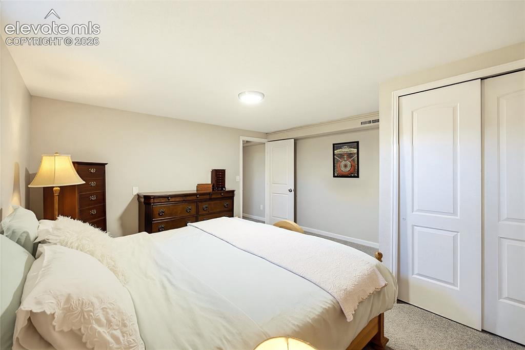 Image 27 of 29: Recessed ceiling lighting, neutral wall tones, carpeted flooring, and a whi