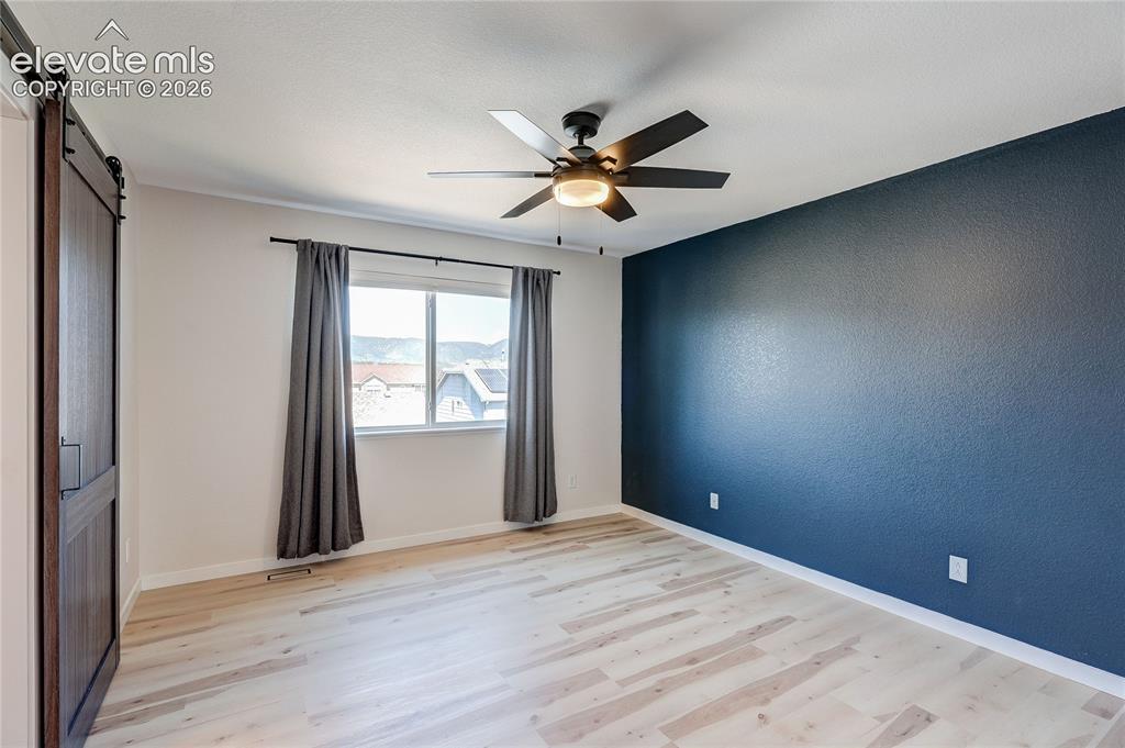 Image 14 of 42: View of living room and kitchen from loft.