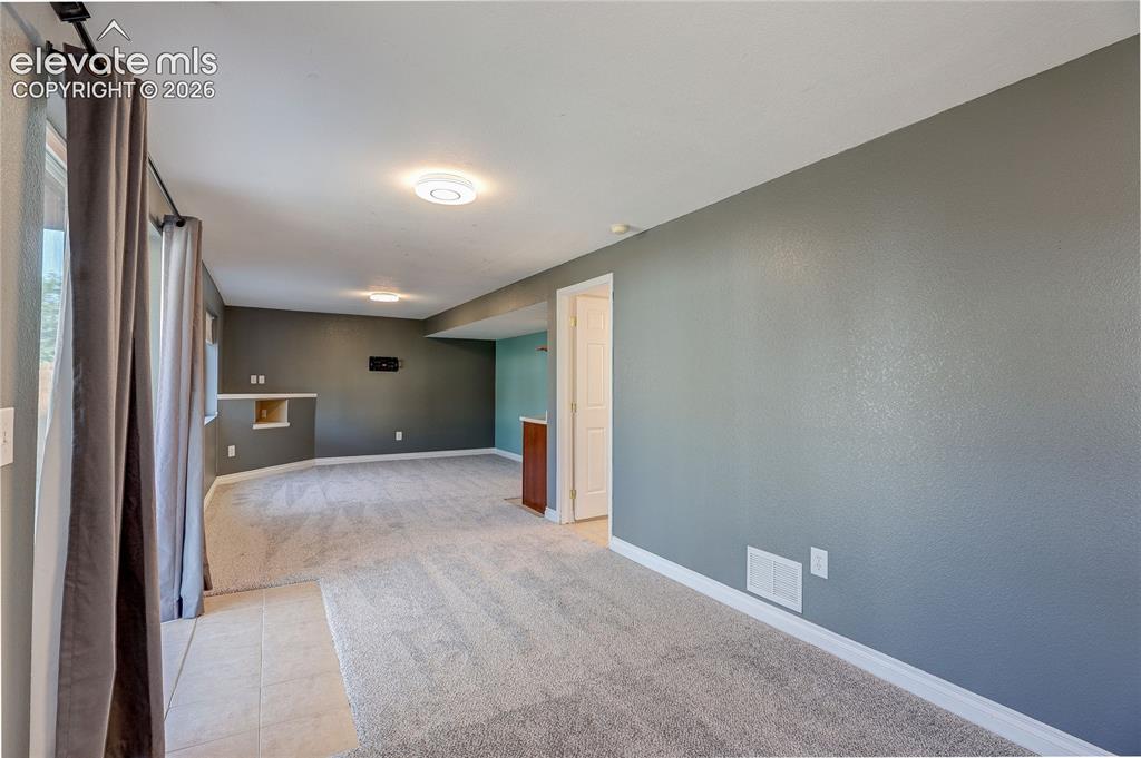 Image 33 of 42: Lower level huge family room