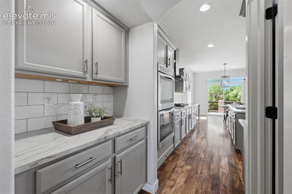 Image 10 of 49: Butlers pantry or coffee bar with more storage!