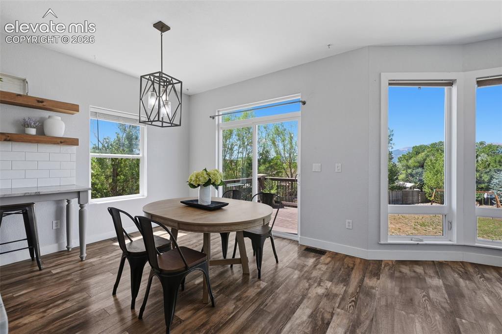 Image 11 of 49: Spacious dining area with views of the entire front range!