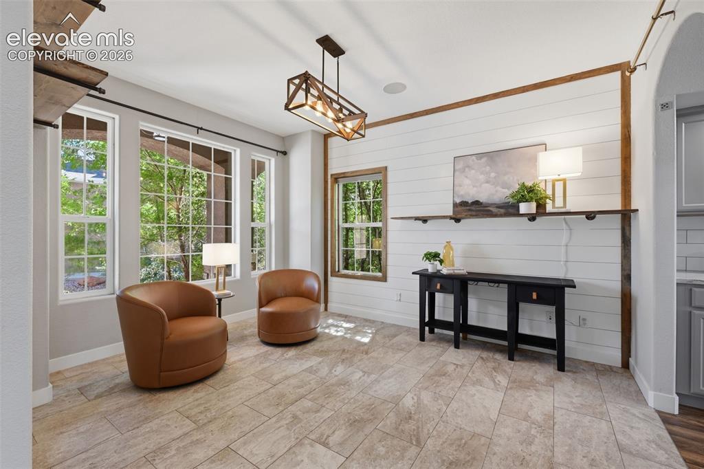 Image 16 of 49: Shiplap focus wall in the front office!  