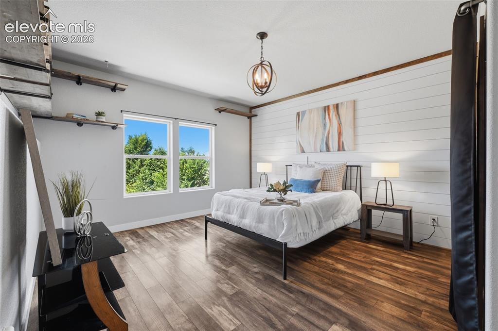 Image 19 of 49: Main level bedroom with views for guests or multi generational living!