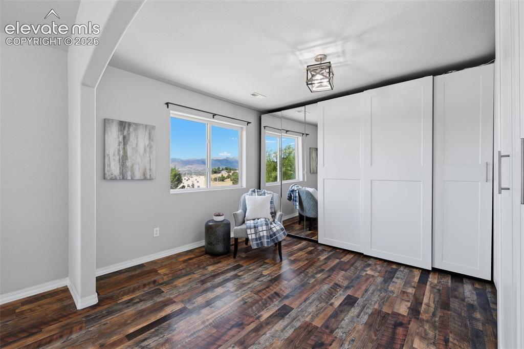 Image 24 of 49: Sitting room with tree house views in your master retreat!