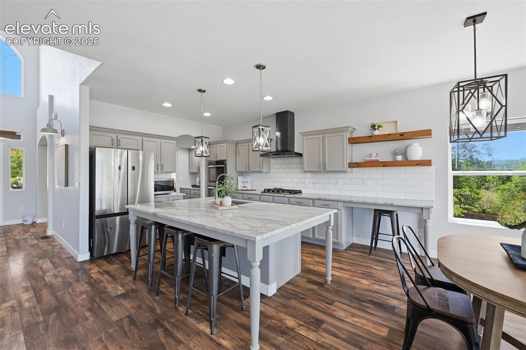 Image 3 of 49: Double ovens, butlers pantry, open shelving and views!